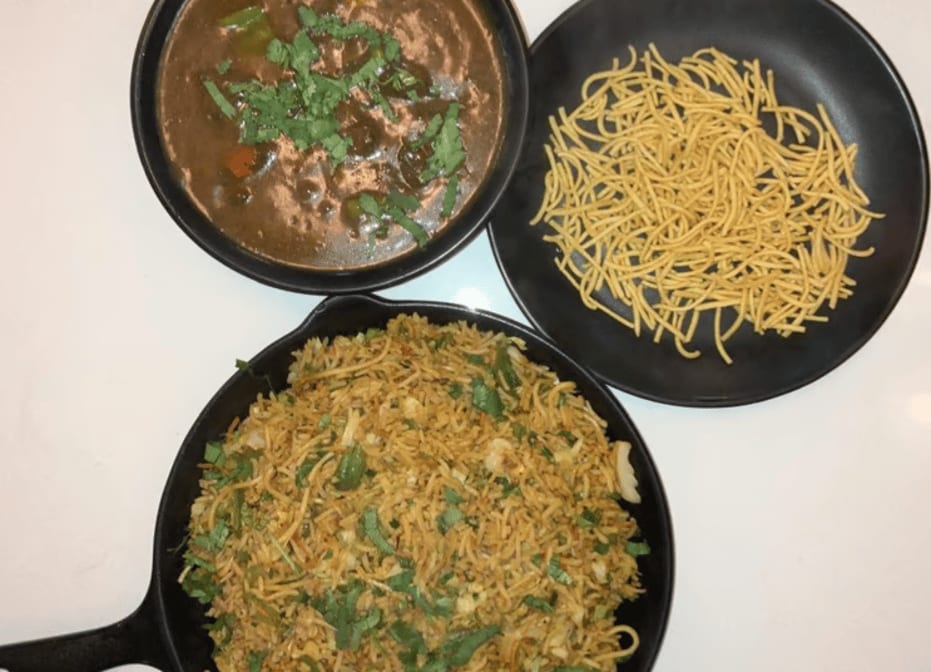 Triple Schezwan Fried Rice (Includes Veg Manchurian Gravy).